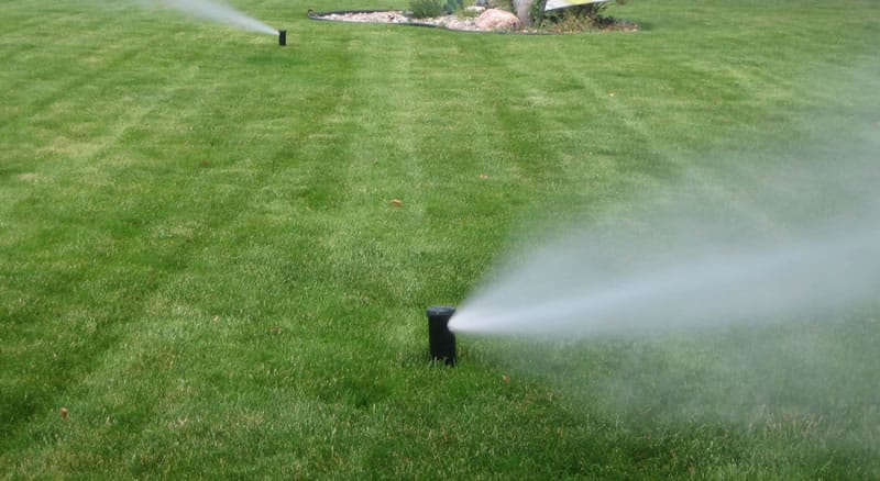 Photo Showing Water Being Blown Out Of Clients Irrigation system.