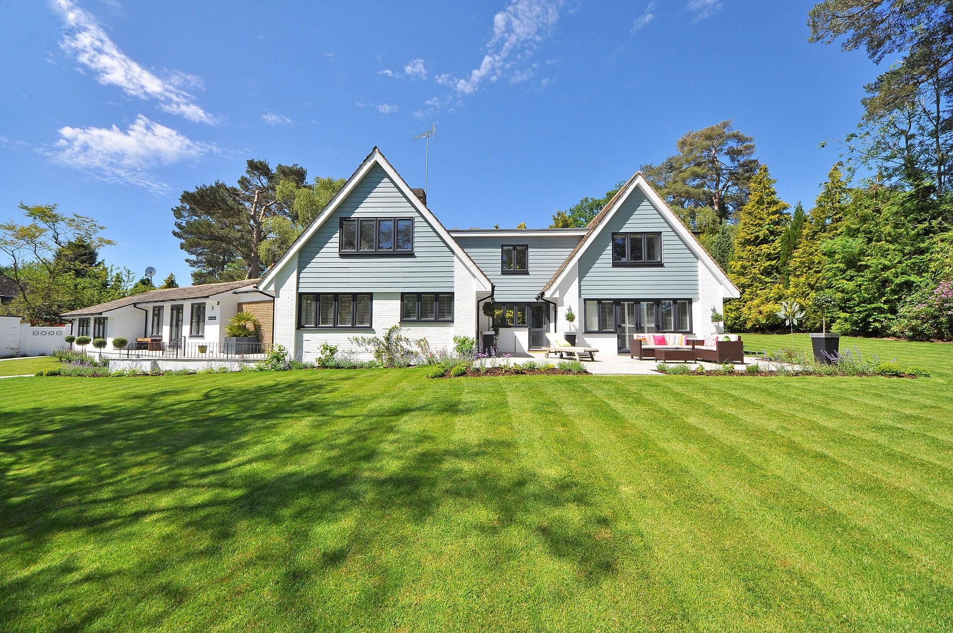 Large backyard with a beautiful lawn